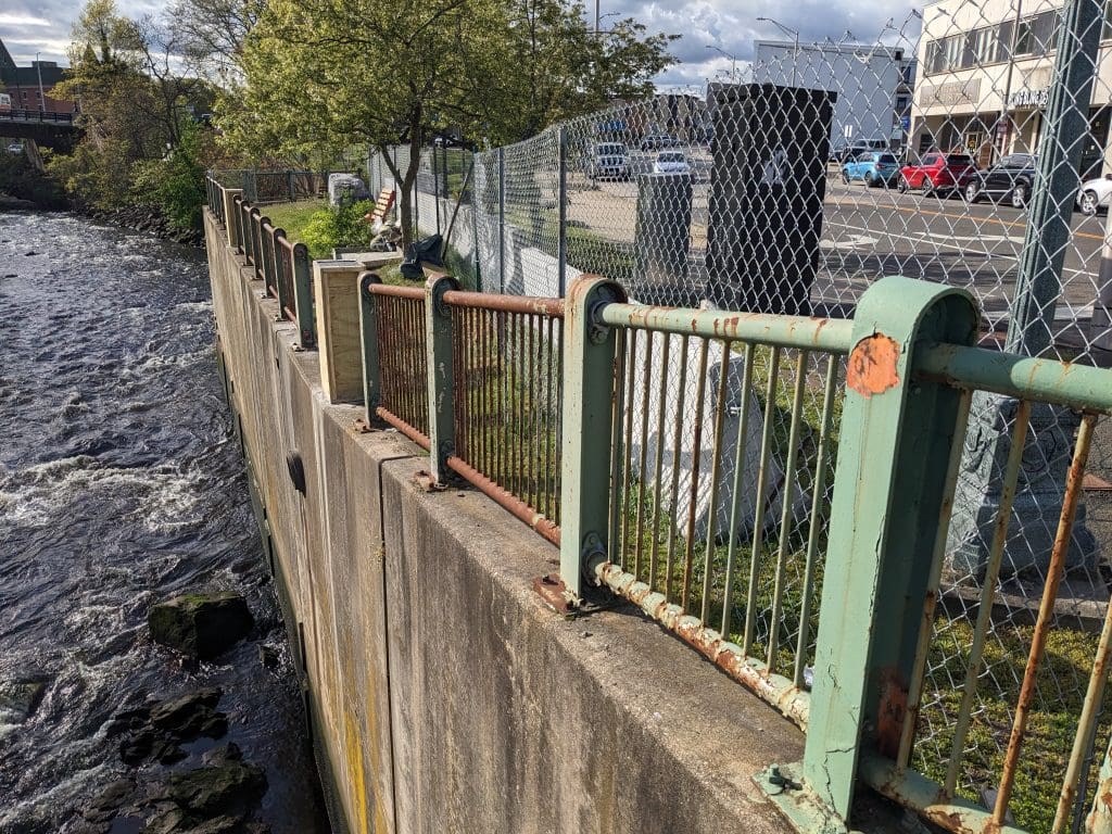 Rusty railing in 1950s era Norwalk park.